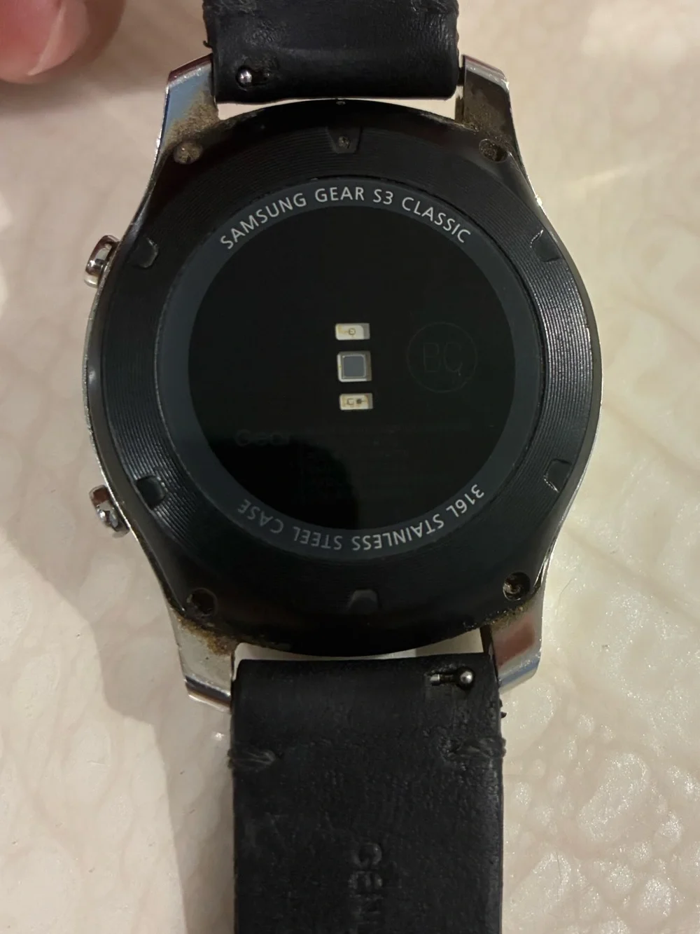 Samsung Silver Smartwatch with Black Strap and Blue Display